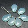 Aqua Blue Chalcedony Faceted Pear Drops Briolette Total 6 Beads and Size 25mm approx.Chalcedony is a cryptocrystalline variety of quartz. Comes in many colors such as blue, pink, aqua. Also known to lower negative energy for healing purposes. 